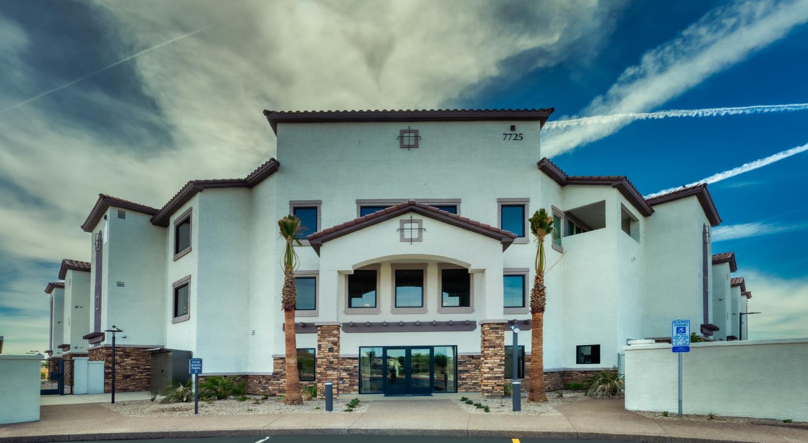 The essence of exceptional living a white building with a blue sky