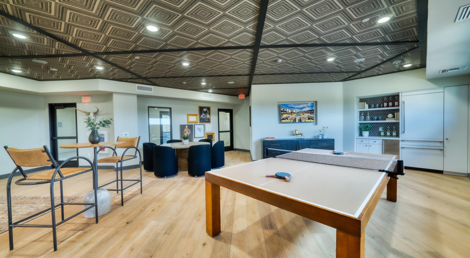 Access to resident-only features a room with tables and chairs