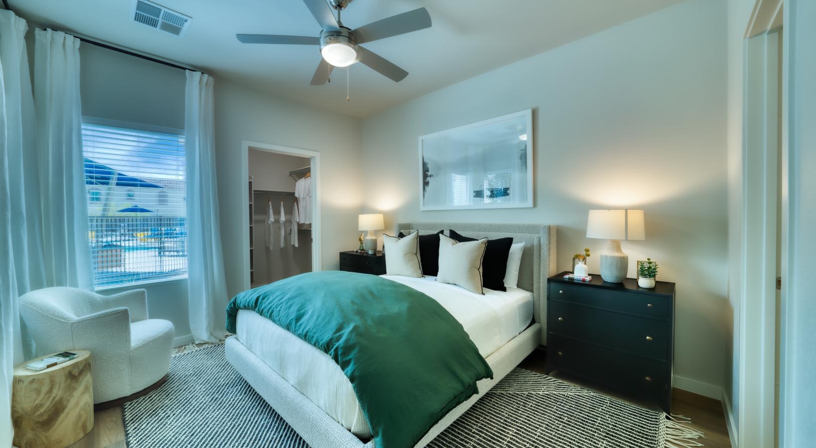 Beautiful bedrooms to fit every need a bedroom with a bed and a fan
