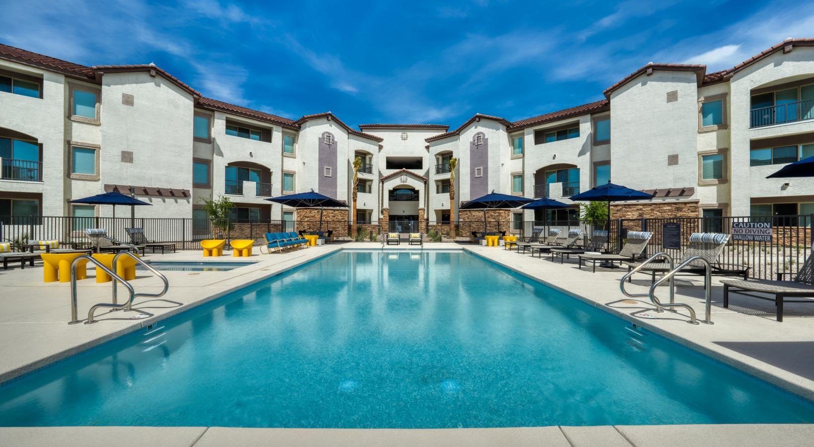 Sparkling swimming pool a pool in a courtyard with buildings around it